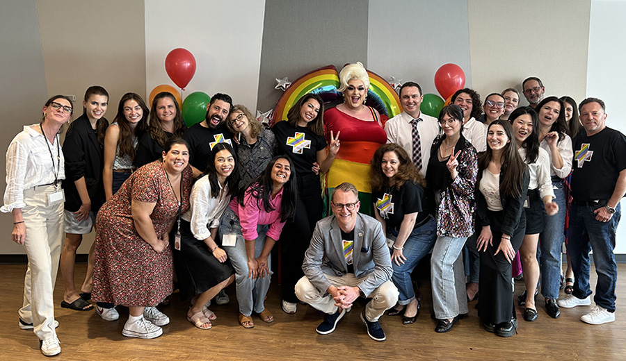A group shot of employees celebrating Pride